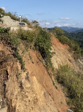 A landslide site with a monitoring sensor. (Credit: Divirod)
